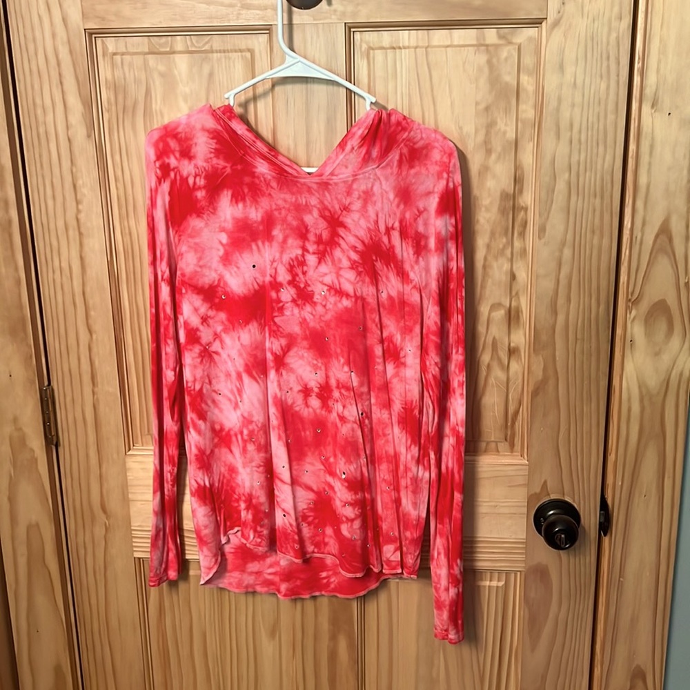 Pink long sleeve shirt with hood.